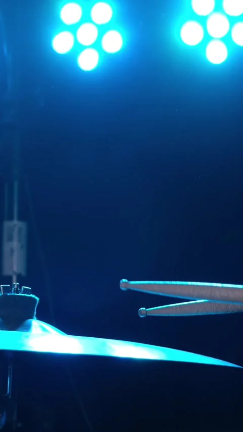 Close-up of drumsticks on a cymbal drum. Vertical video. Stock Footage 275972104