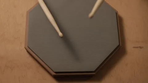 Close-up of drumsticks practicing on a hexagonal practice pad Vidéo 341737548