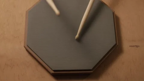 Close-up of drumsticks practicing on a practice pad for musical rhythm Vidéo 341737778