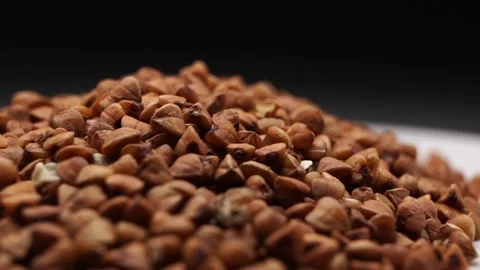 Close-up of dry buckwheat showcasing texture for healthy eating presentations Stock Footage 288858616