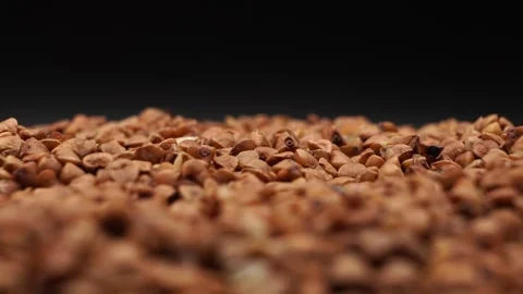 Close-up of dry buckwheat showcasing texture for healthy eating presentations Stock Footage 288859646