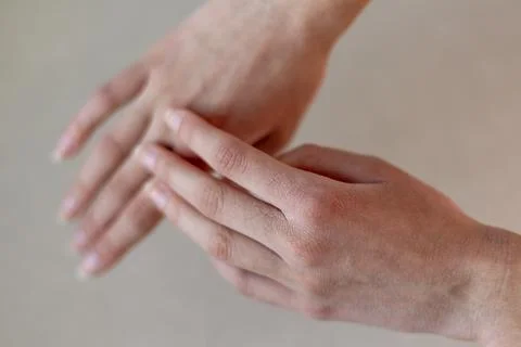 Close-up of Dry Hands with Minimal Background. Close-up image of two hands with Stock Photos