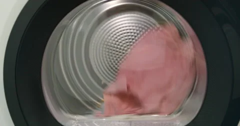 Close up of drying machine. Drying laundry clothes. Dryer laundry machine. Stock Footage 171826428