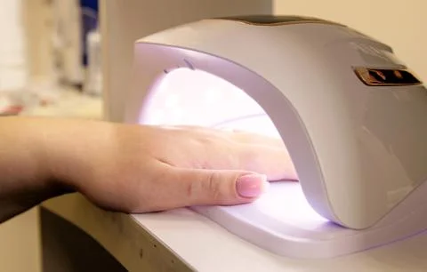 Close-up of drying nails in a lamp Stock Photos