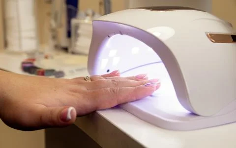 Close-up of drying nails in a lamp Stock Photos