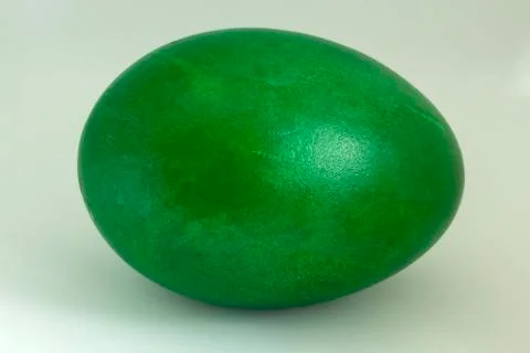 Close-up of a duck egg colored in green. Stock Photos