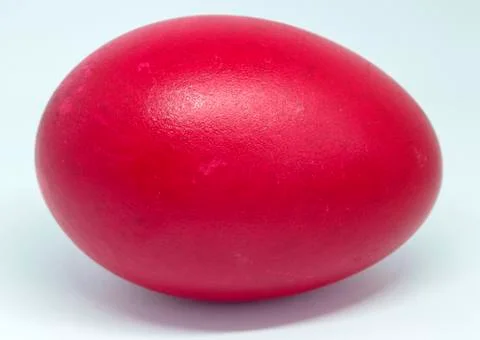 Close-up of a duck egg in red. Stock Photos