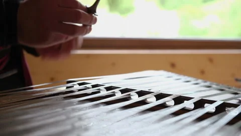 Close up of dulcimer string and wooden bat. Playing traditional musical instrume Video stock 163530409