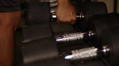 Close-Up of Dumbbell Lying on Rack in Gym Sports Equipment Concept for Effe.. Stock Footage 256750461