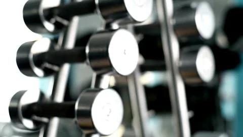 Close-Up of Dumbbell Lying on Rack in Gym Sports Equipment Concept for Effe.. Stock Footage 256751538