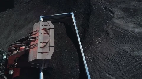 Close-up of a dump truck loading coal, drone video. A powerful mining loader Stock Footage 169590216