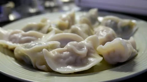 Close up dumplings in a plate with smoke Stock Footage 64203755