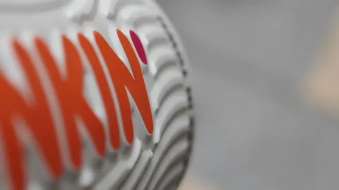 Close up of dunkin' coffee cup, a study in branding Stock-Footage 308035804