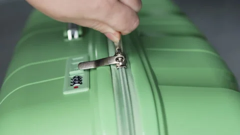 Close up of durable zipper being smoothly closed by confident hands. Stock Footage 312638783