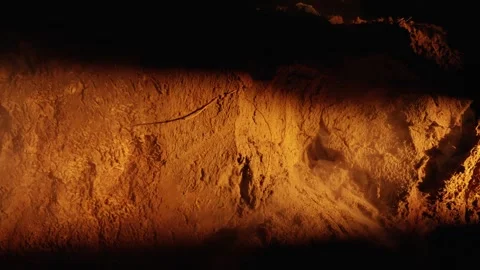 Close up of dust exploding from a collapsing soil wall Stock Footage 341294582