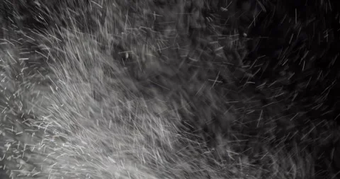 Close-up of dust floating on a black background Stock Footage 328630055