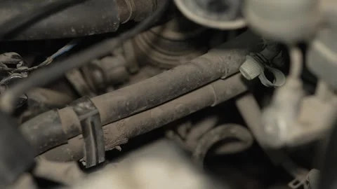 A close up of dusty car air conditioning pipes and valve. Stock Footage 342729996
