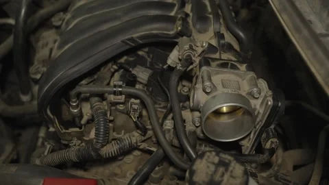 Close-up of a dusty car engine block with a throttle body valve. Stock Footage 340558848
