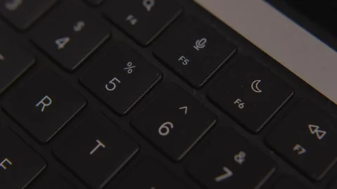 Close-up of dusty computer keyboard with visible dirt and particles on keys Видео 317952032