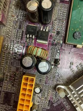 Close-up of Dusty Computer Motherboard Circuitry and Components Stock Photos
