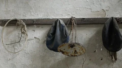 Close-up of Dusty Lamp Shade Hanging on Weathered Wooden Beam Video stock 335462455