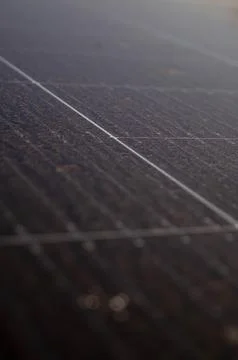 Close-up of dusty solar panel surface with visible dirt accumulation and gr.. Stock Photos
