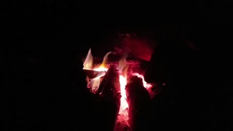 Close-up of Dying Embers and Glowing Coals in Traditional Iron Stove Stock Footage 315332953