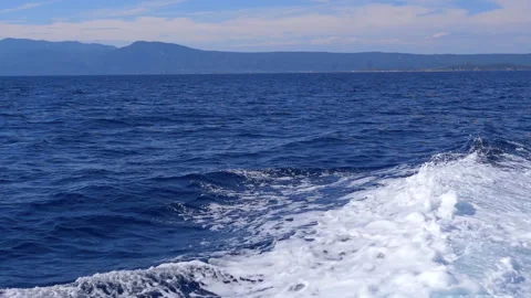 Close-up of dynamic foamy sea waves crashing and raging in the Aegean Sea Stock Footage 313869228