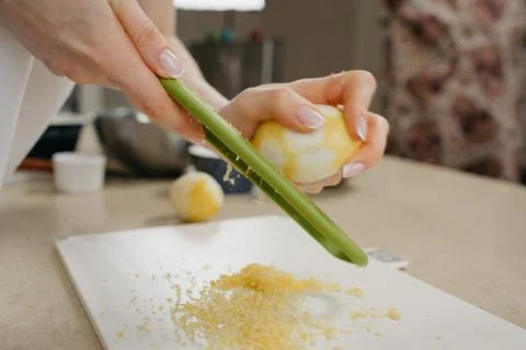 A close dynamic photo from the side of the hands of a woman who is separating Stock Photos