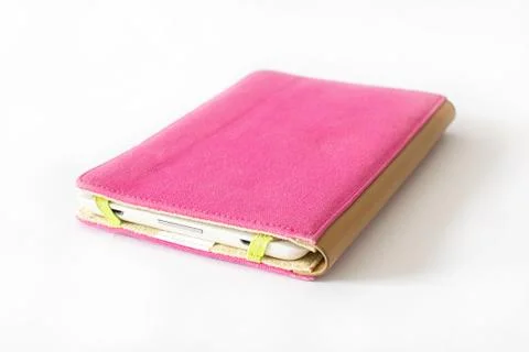 Close Up of an E-book reader in pink case on white background Stock Photos