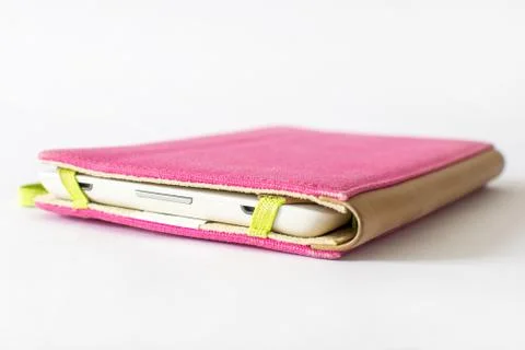Close Up of an E-book reader in pink case on white background Stock Photos