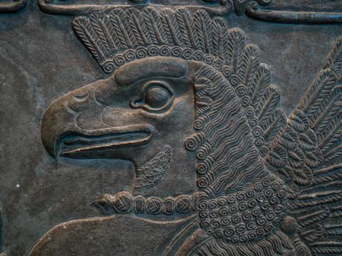 A close-up of an Eagle headed protective spirit carving. British Museum. Stock Photos