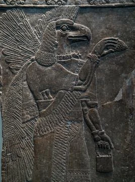 A close-up of an Eagle headed protective spirit carving, British Museum. Stock Photos