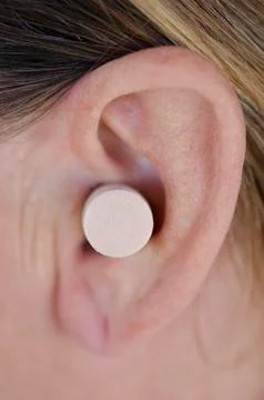 Close up ear with protective plug. Stock-Fotos