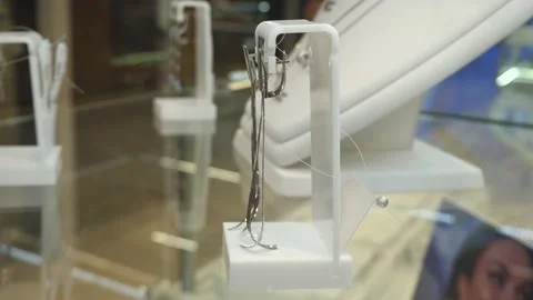 A close-up of an earring made of white gold material Stock-Footage 303923681