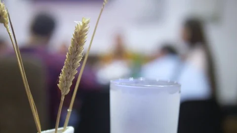 Close-up. ears of wheat and beer glass on a blurred background people at the Stock Footage 116810439