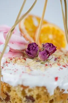 Close-up of an Easter cake. Dried oranges and roses on top of the cake Stock Photos