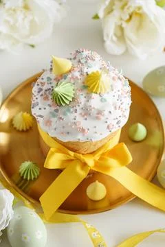 Close up Easter Cake with Flowers and Pastel Eggs on White Background Stock Photos