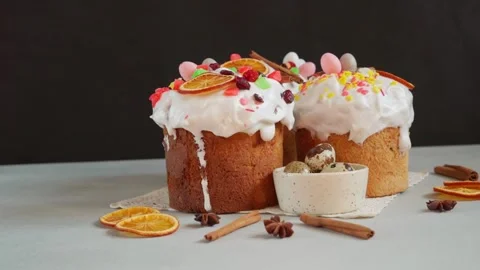 Close up of Easter Cakes decoreted with dried Fruits on Grey Background Stock Footage 236855243