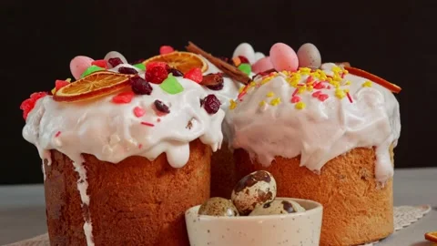 Close up of Easter Cakes decoreted with dried Fruits on Grey Background Stock Footage 236855300
