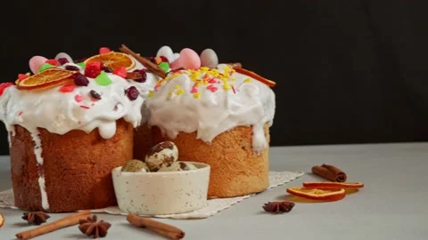 Close up of Easter Cakes decoreted with dried Fruits on Grey Background Stock Footage 236855311