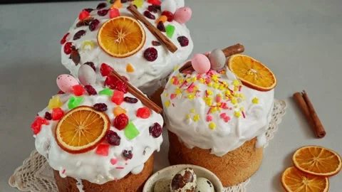 Close up of Easter Cakes decoreted with dried Fruits on Grey Background Stock Footage 236855369
