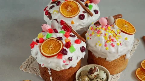 Close up of Easter Cakes decoreted with dried Fruits on Grey Background Stock Footage 236855384