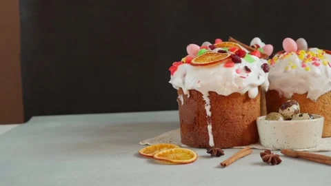 Close up of Easter Cakes decoreted with dried Fruits on Grey Background Stock Footage 236855404