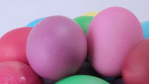 Close up easter colorful chicken eggs rotating on light background Stock Footage 171061756