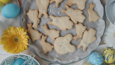 Close Up of Easter Cookies and Dyed Eggs on Table 動画素材 124577811