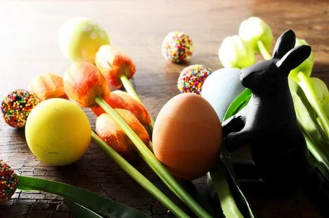 Close up of Easter decoration and rabbit doll and tulips flower Stock Photos