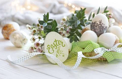 Close-up, Easter eggs and flowers on a blurred background. Stock Photos