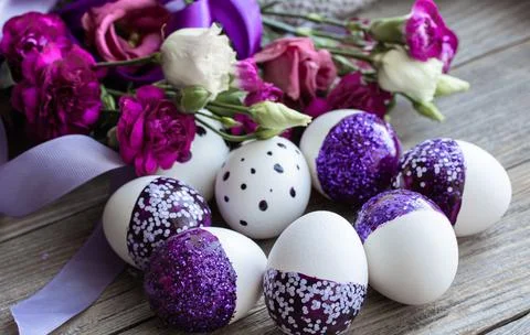 Close-up of Easter eggs decorated with purple sparkles. Stock Photos