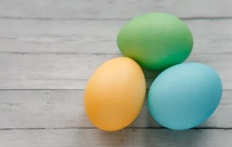 Close-up. Easter eggs on a light wooden background 写真素材